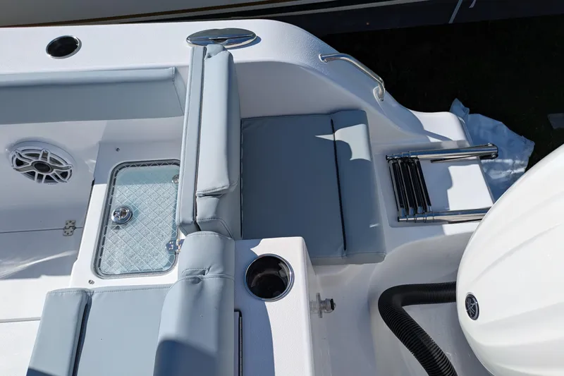 Slide: The Image of 2026 Sportsman Heritage 261 Center Console boat interior with seating and storage features. - 6