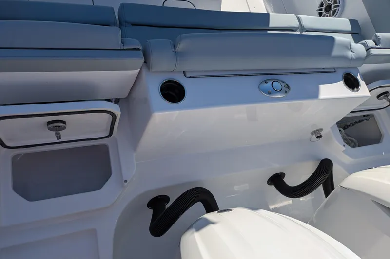 Slide: The Image of 2026 Sportsman Heritage 261 Center Console boat interior with seating and storage compartments. - 7