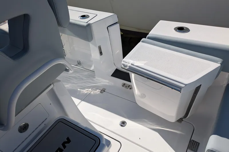 Slide: The Image of 2026 Sportsman Heritage 261 Center Console boat interior with seating and storage compartments. - 9