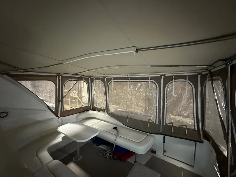 Slide: The Image of Interior of a 1997 Sea Ray Sundancer 400 with seating area and table. - 4