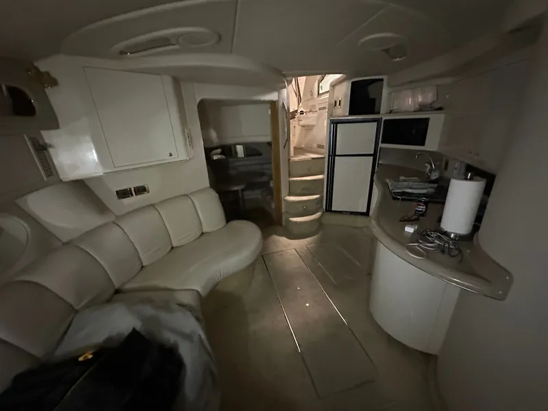 Slide: The Image of Interior of a 1997 Sea Ray Sundancer 400 yacht with sofa and kitchenette. - 6
