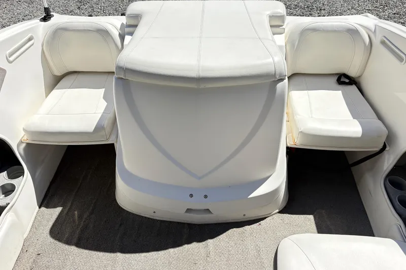 Slide: The Image of 2009 Bayliner 185 Bowrider interior with white seating and cup holders. - 7