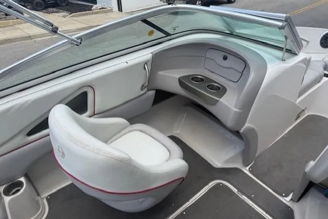 Slide: The Image of 2011 Bryant 210 boat interior with seating and cup holders. - 15