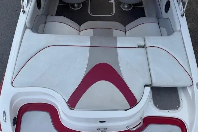 Slide: The Image of 2011 Bryant 210 boat interior with white and red seating design. - 25