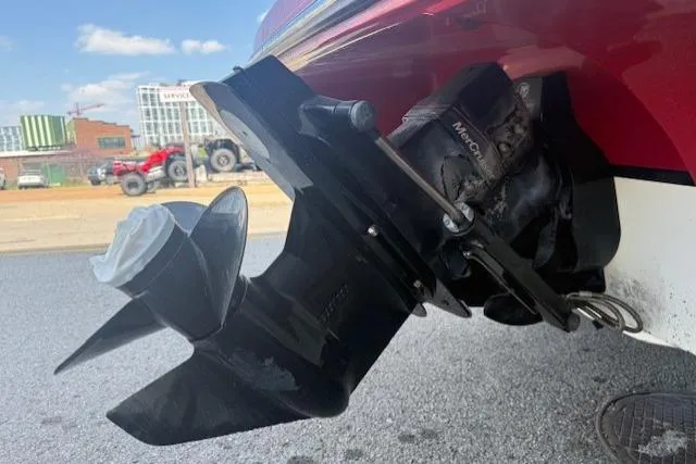 Slide: The Image of Propeller and outdrive of a 2011 Bryant 210 boat, parked on urban street. - 27