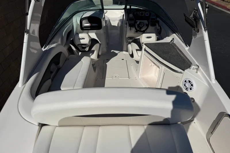 Slide: The Image of 2011 Chaparral 267 SSX boat interior with white seating and helm. - 10