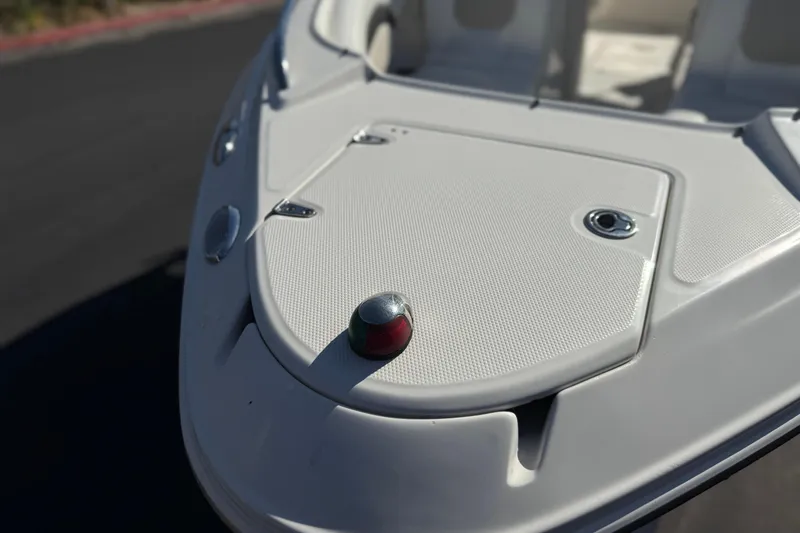 Slide: The Image of 2011 Chaparral 267 SSX boat bow with navigation light and textured deck. - 11