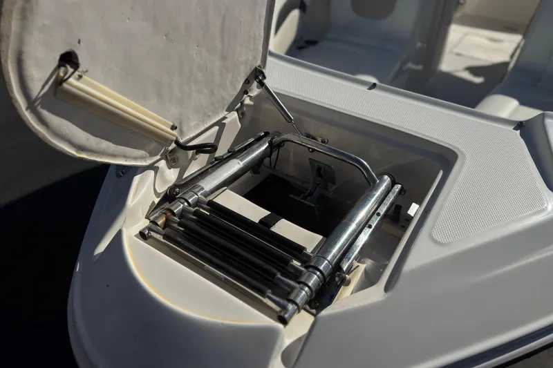 Slide: The Image of 2011 Chaparral 267 SSX boat ladder compartment, open and detailed view. - 12