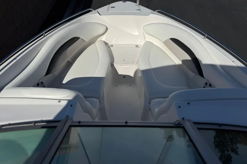 Slide: The Image of Bow seating area of a 2011 Chaparral 267 SSX boat with white upholstery. - 14