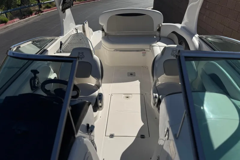 Slide: The Image of 2011 Chaparral 267 SSX boat interior with seating and steering wheel. - 18
