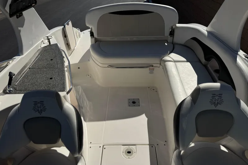 Slide: The Image of Interior view of a 2011 Chaparral 267 SSX boat with seating and storage. - 20