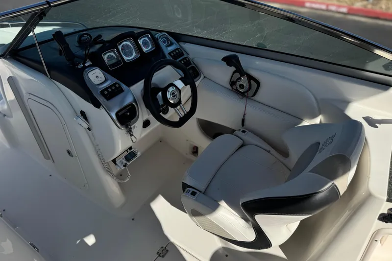 Slide: The Image of Interior cockpit of 2011 Chaparral 267 SSX boat with steering wheel and controls. - 32