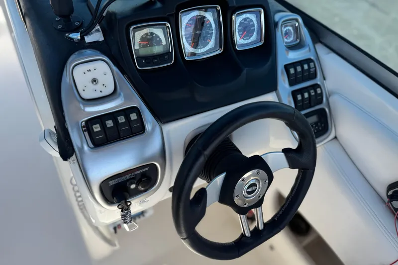 Slide: The Image of Steering console of 2011 Chaparral 267 SSX boat with gauges and controls. - 34