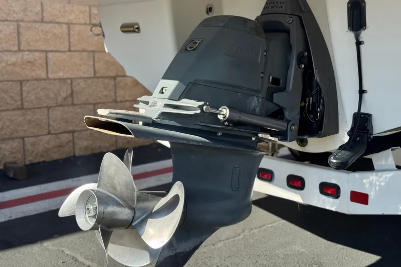 Slide: The Image of 2011 Chaparral 267 SSX boat with Volvo Penta outdrive and propeller, parked on trailer. - 6