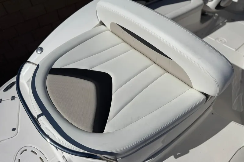 Slide: The Image of 2011 Chaparral 267 SSX boat seat with white and black upholstery. - 8