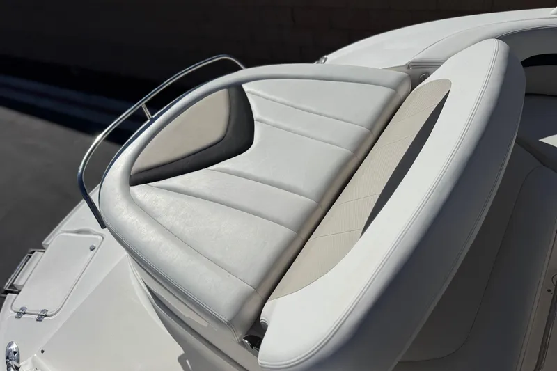 Slide: The Image of Luxury seating on 2011 Chaparral 267 SSX boat, featuring sleek white upholstery. - 9