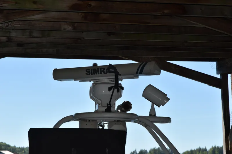 Slide: The Image of Radar equipment on a 2005 SAFE Boats 33 Full Cabin under a wooden structure. - 11