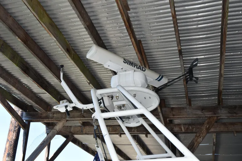 Slide: The Image of Radar equipment on a 2005 SAFE Boats 33 Full Cabin under a metal roof. - 13