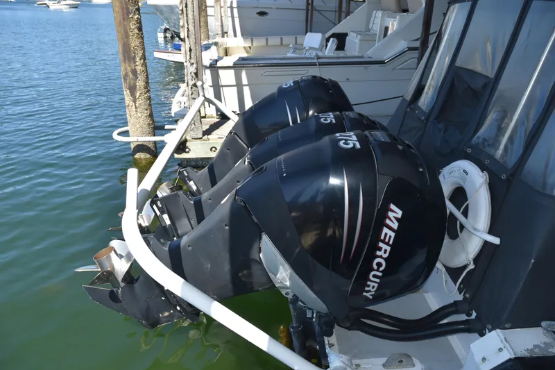Slide: The Image of Twin Mercury outboard engines on a 2005 SAFE Boats 33 Full Cabin vessel. - 14