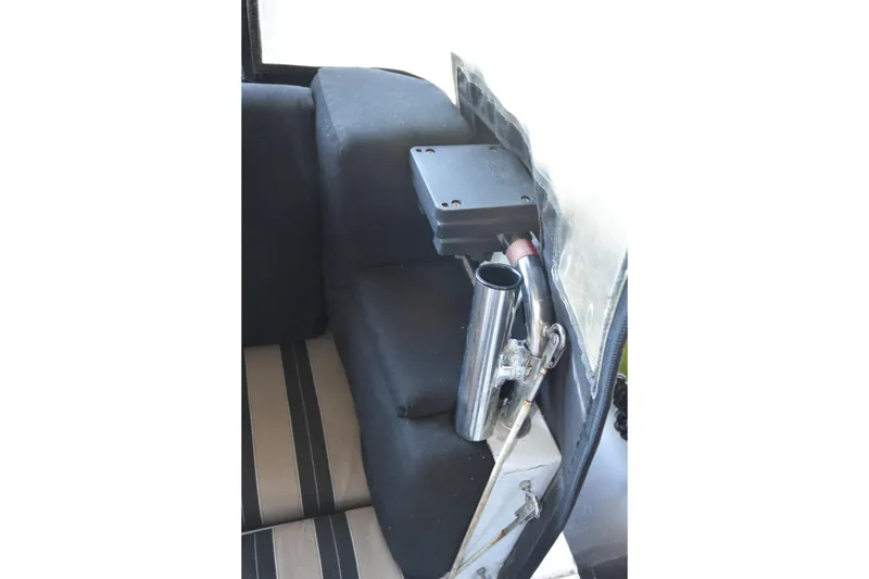 Slide: The Image of Interior of 2005 SAFE Boats 33 Full Cabin, featuring seating and metal fixtures. - 21