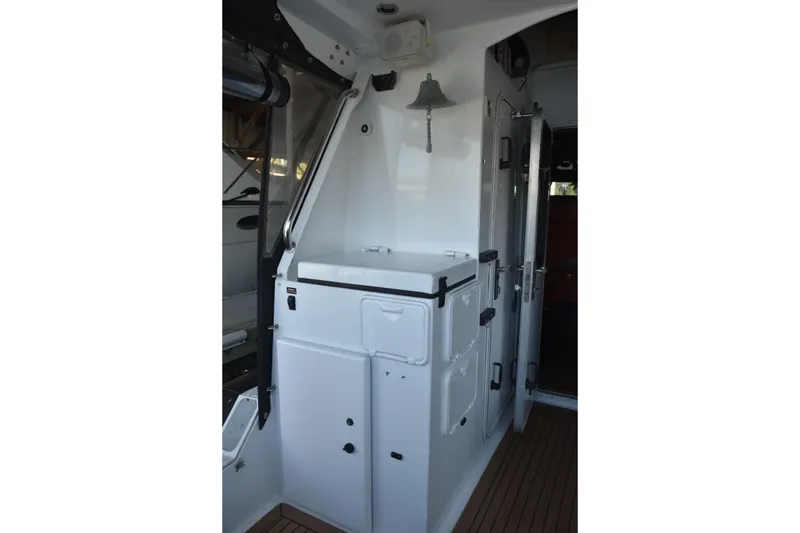 Slide: The Image of 2005 SAFE Boats 33 Full Cabin interior with storage compartments and bell. - 27