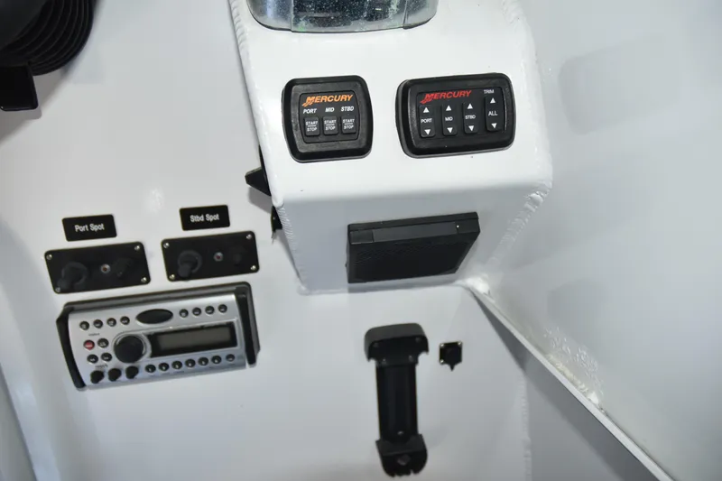 Slide: The Image of Control panel of a 2005 SAFE Boats 33 Full Cabin with Mercury controls. - 34