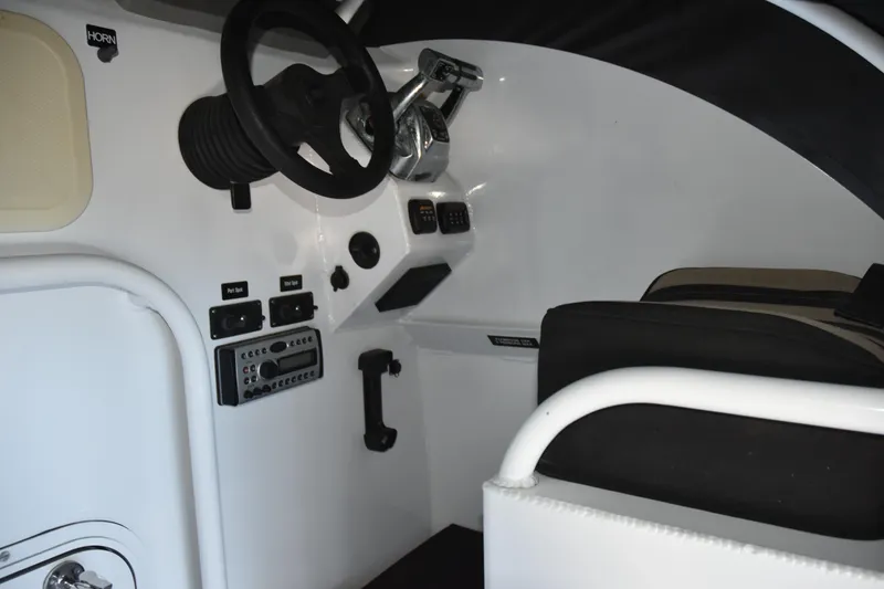 Slide: The Image of Interior of 2005 SAFE Boats 33 Full Cabin, featuring steering wheel and control panel. - 36