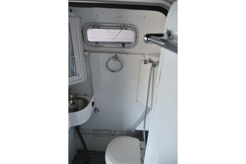 Slide: The Image of Interior of 2005 SAFE Boats 33 Full Cabin, featuring compact bathroom amenities. - 38