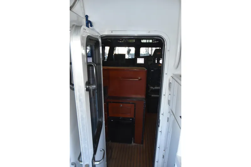 Slide: The Image of Interior view of 2005 SAFE Boats 33 Full Cabin, showcasing cabin entrance and control area. - 40
