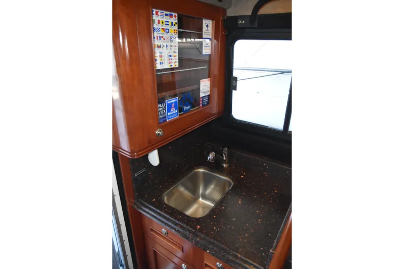 Slide: The Image of Compact kitchenette in 2005 SAFE Boats 33 Full Cabin with sink and storage. - 43