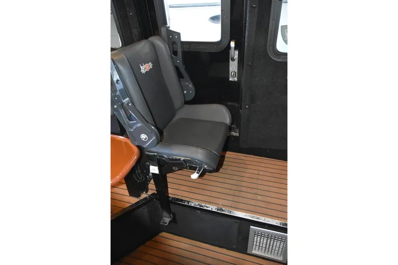 Slide: The Image of Interior seat of 2005 SAFE Boats 33 Full Cabin with wood-style flooring. - 53