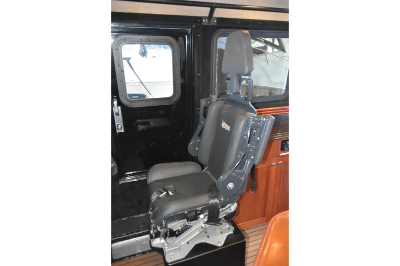 Slide: The Image of Captain's chair inside 2005 SAFE Boats 33 Full Cabin, featuring ergonomic design and sturdy construction. - 54