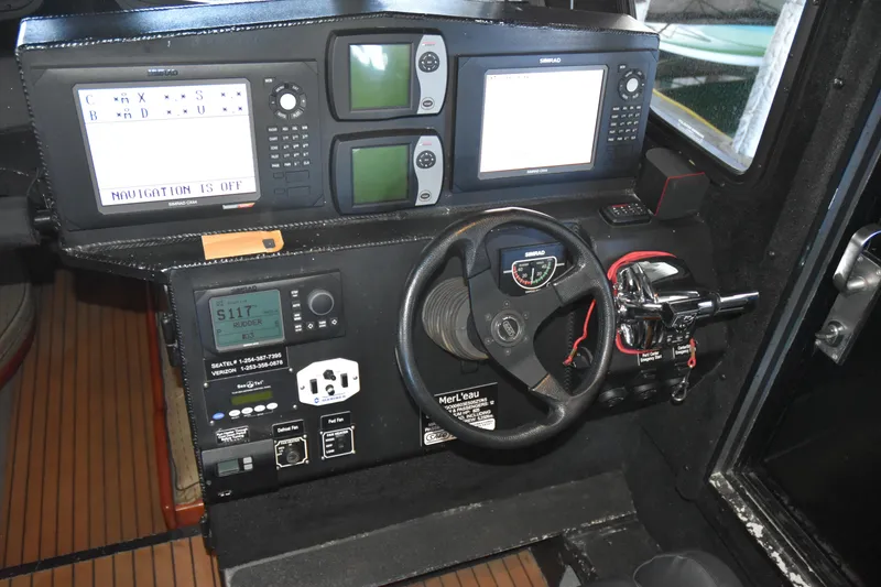 Slide: The Image of Control panel of a 2005 SAFE Boats 33 Full Cabin with navigation equipment. - 55