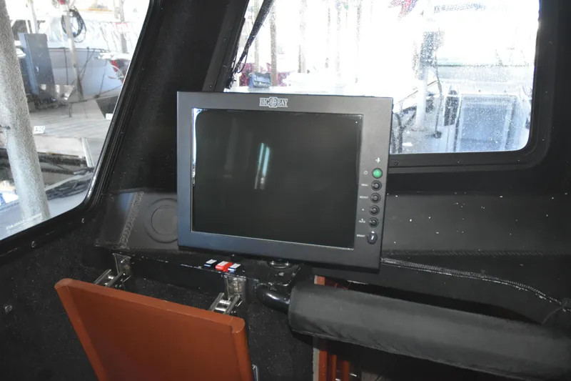Slide: The Image of Control panel inside a 2005 SAFE Boats 33 Full Cabin vessel. - 57