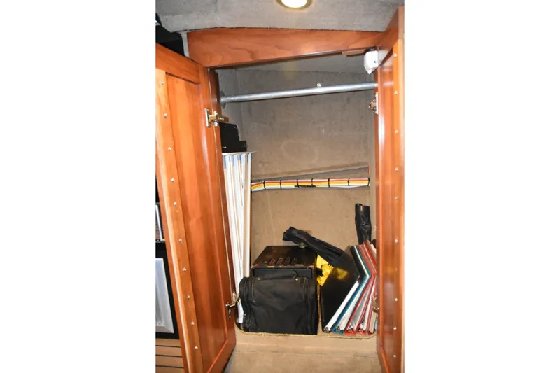 Slide: The Image of Interior storage space of 2005 SAFE Boats 33 Full Cabin, featuring shelves and organized items. - 58