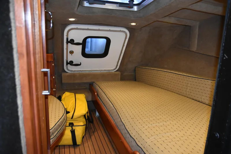 Slide: The Image of 2005 SAFE Boats 33 Full Cabin interior with bed and yellow bag. - 59