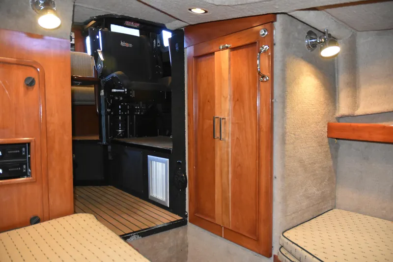 Slide: The Image of Interior of 2005 SAFE Boats 33 Full Cabin with wood paneling and seating. - 60