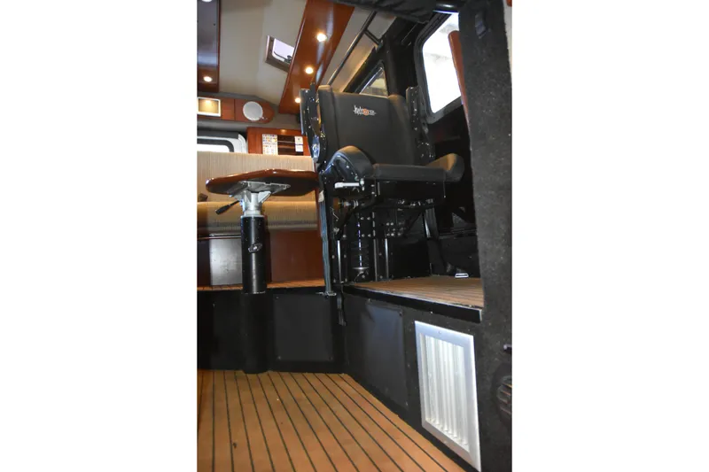Slide: The Image of Interior of 2005 SAFE Boats 33 Full Cabin with seating and wooden flooring. - 63