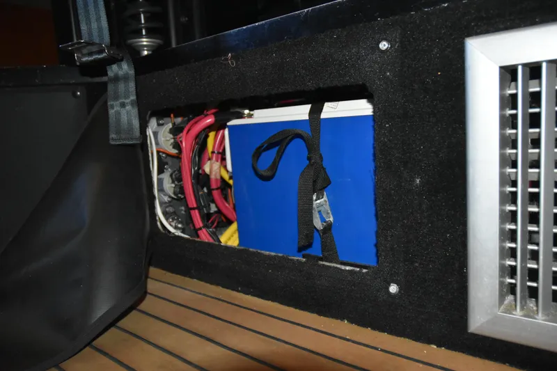 Slide: The Image of Electrical compartment of 2005 SAFE Boats 33 Full Cabin with wiring and battery. - 65