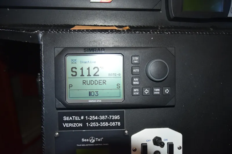 Slide: The Image of Simrad AP25 autopilot display on 2005 SAFE Boats 33 Full Cabin dashboard. - 68