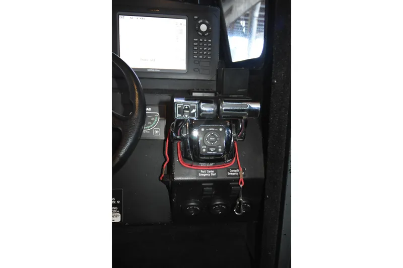 Slide: The Image of Control panel of a 2005 SAFE Boats 33 Full Cabin with navigation equipment. - 70