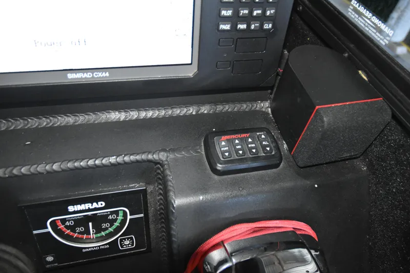 Slide: The Image of Control panel of a 2005 SAFE Boats 33 Full Cabin with Simrad navigation equipment. - 71