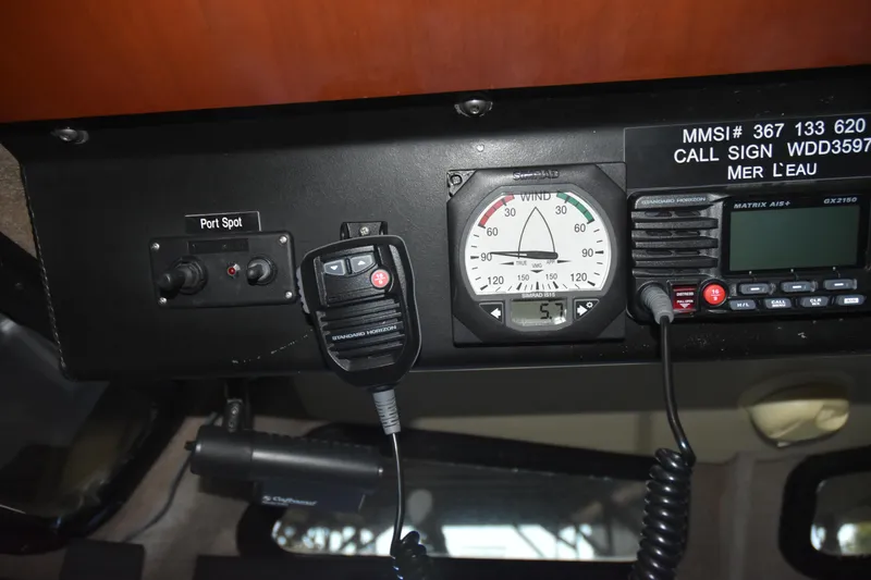 Slide: The Image of Control panel of 2005 SAFE Boats 33 Full Cabin with radio and wind gauge. - 72