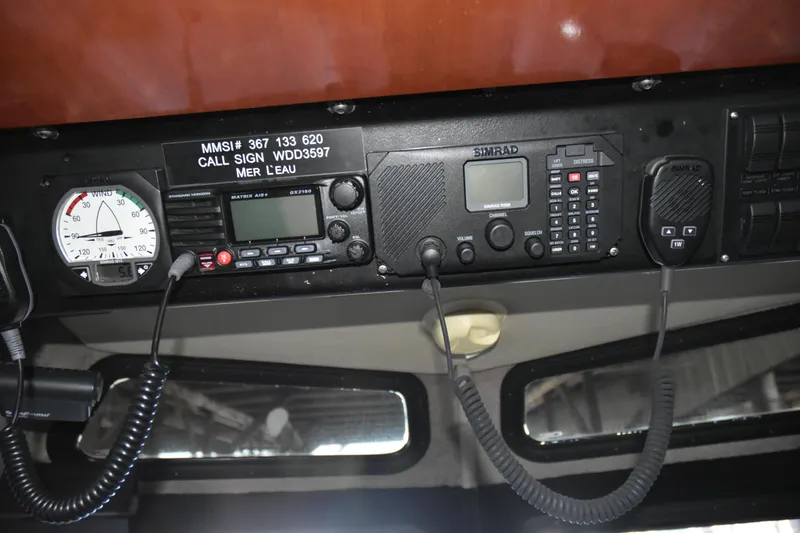 Slide: The Image of Control panel of a 2005 SAFE Boats 33 Full Cabin with communication equipment. - 73