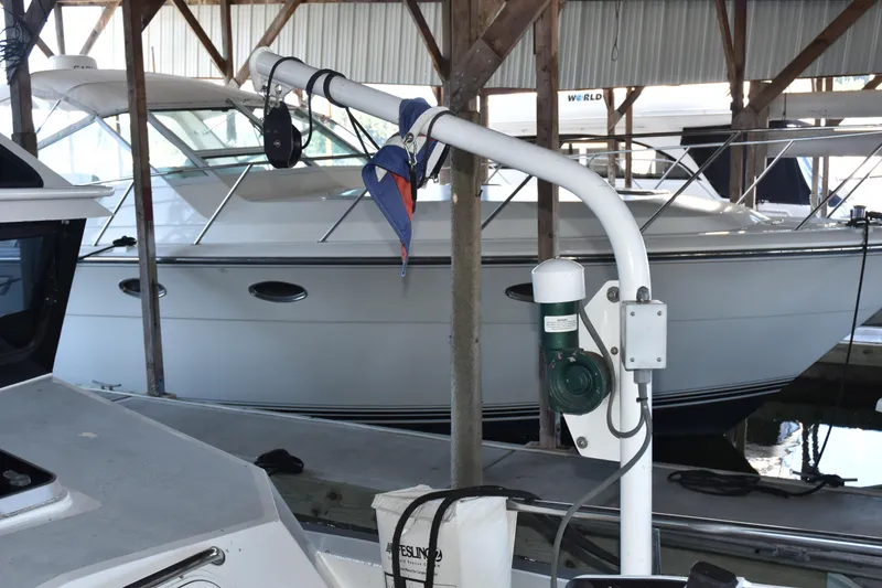Slide: The Image of 2005 SAFE Boats 33 Full Cabin docked in a covered marina. - 8