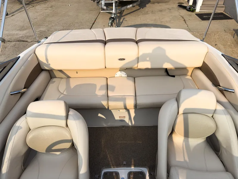 Slide: The Image of 2007 Chaparral 190 SSi boat interior with beige seating and carpeted floor. - 10