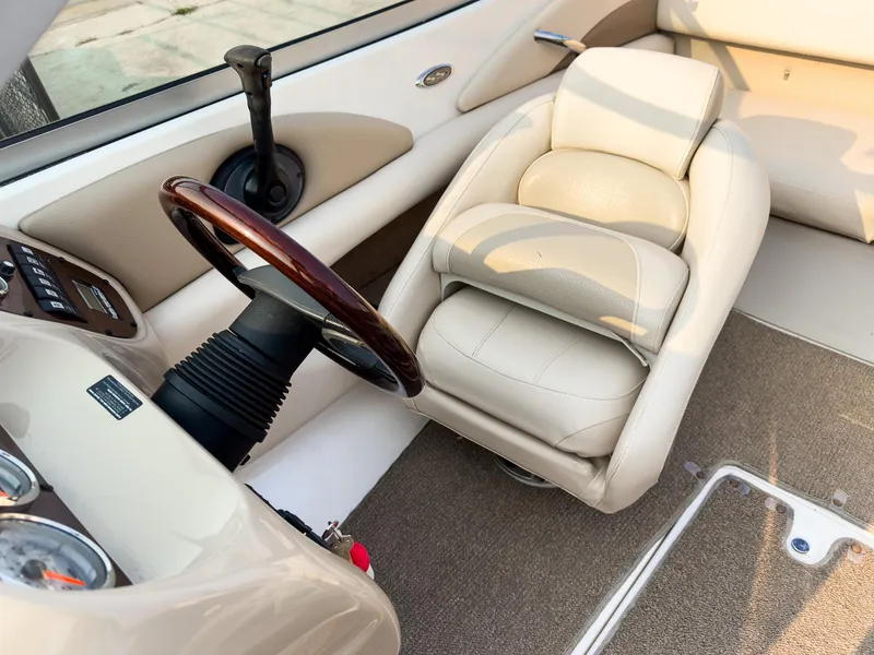 Slide: The Image of 2007 Chaparral 190 SSi boat interior with steering wheel and beige seating. - 12