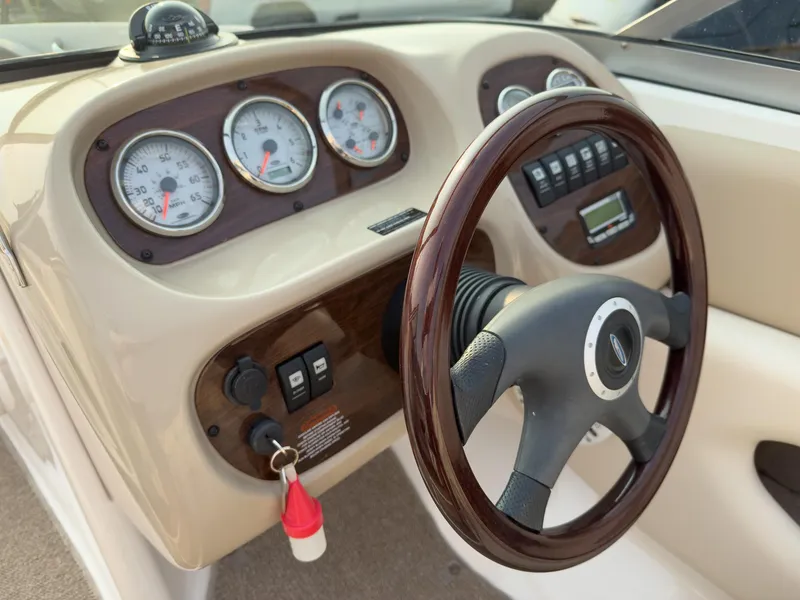 Slide: The Image of 2007 Chaparral 190 SSi boat dashboard with gauges and steering wheel. - 13