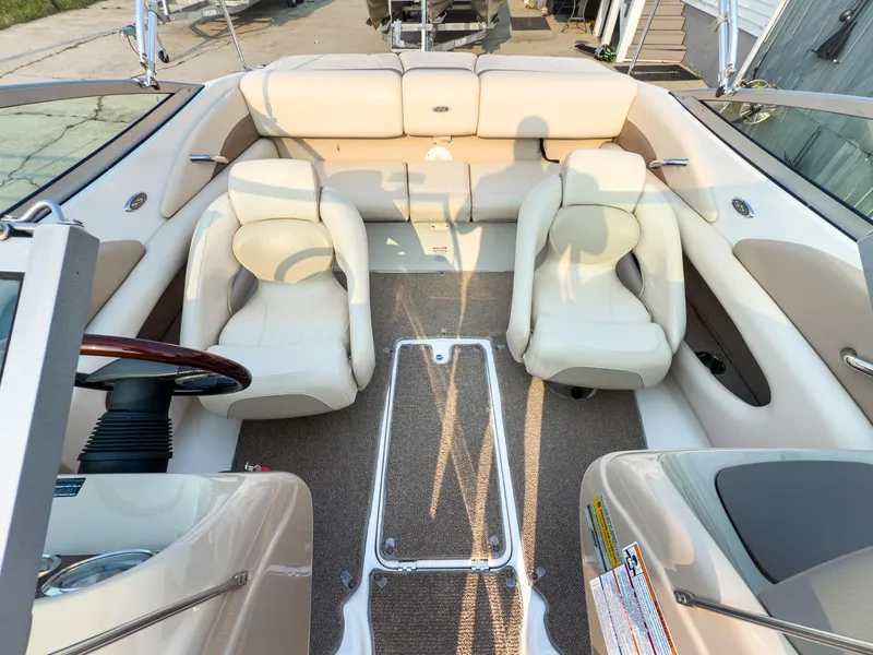 Slide: The Image of 2007 Chaparral 190 SSi boat interior with beige seating and steering wheel. - 21
