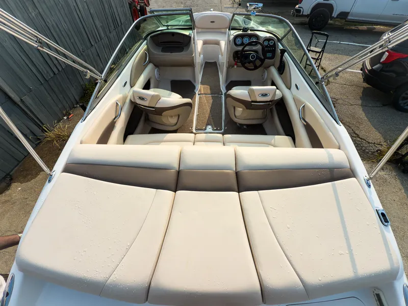 Slide: The Image of 2007 Chaparral 190 SSi boat interior with beige seating and dashboard view. - 7